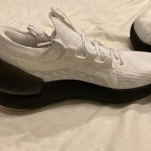 White and black Under Armour Phantom running shoes